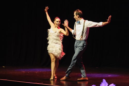 male and female dancers on stage